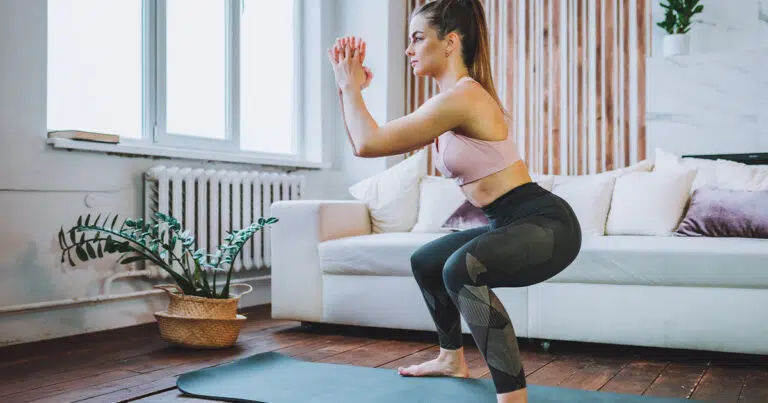 Woman doing squats for bigger butt